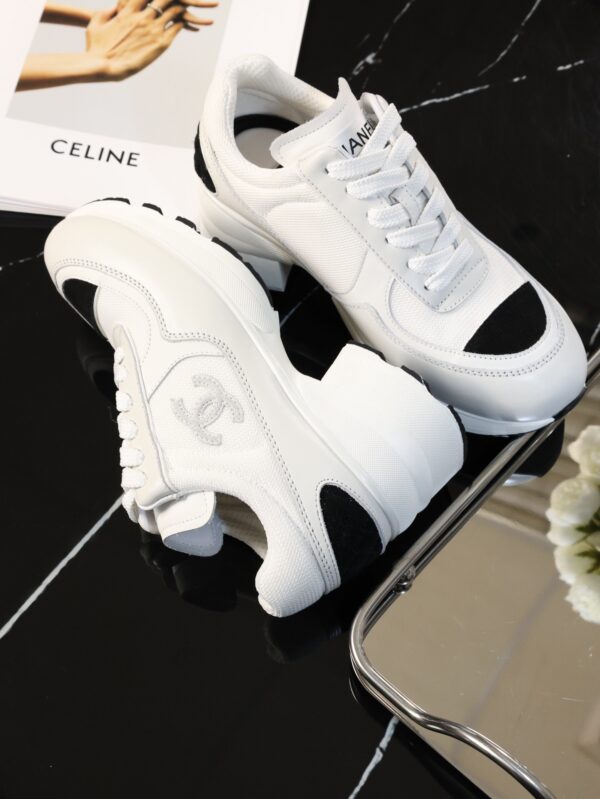 Chanel White and Black Leather Low-Top Sneaker with Cap-Toe and CC Logo