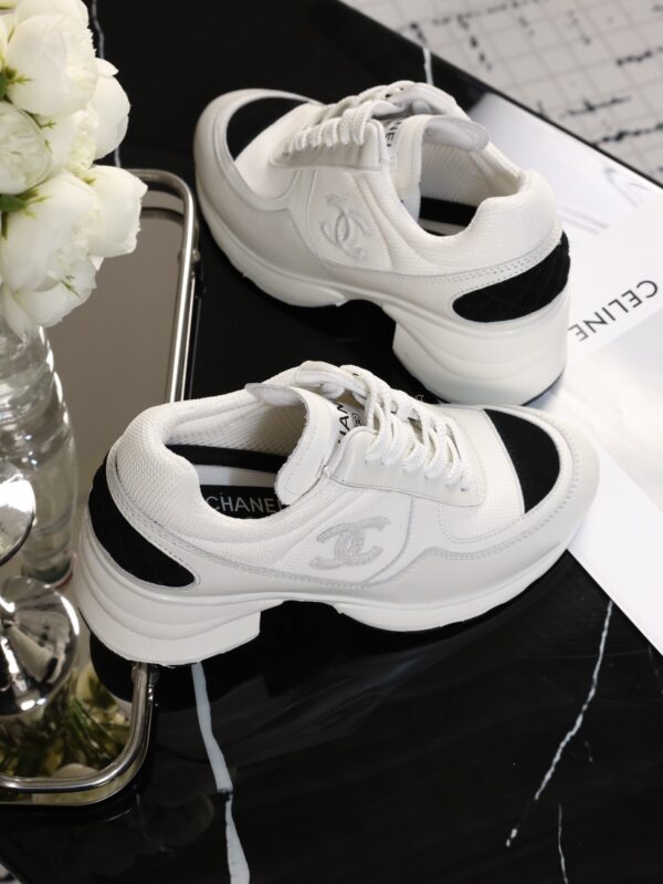 Chanel White and Black Leather Low-Top Sneaker with Cap-Toe and CC Logo