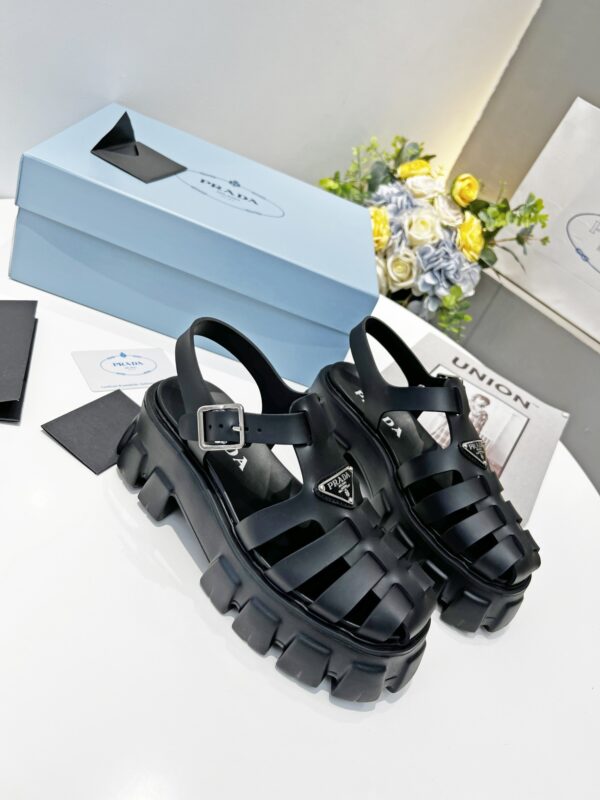 sy_no_2E421CEF8F068595925F6800E09AA7E1_0 Prada Black Rubber Weave Triangle Tread Platform Sandal