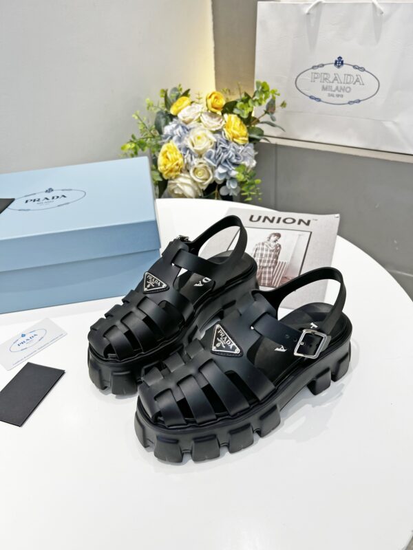 sy_no_2E421CEF8F068595925F6800E09AA7E1_1 Prada Black Rubber Weave Triangle Tread Platform Sandal