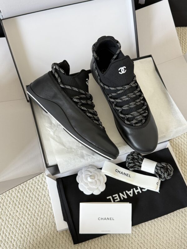 sy_no_301C920624F03E29F93F7AC768B3CE56_1 Chanel Black Leather and Knit Slip-On Low-Top Sneaker with Speckled Laces and CC Logo