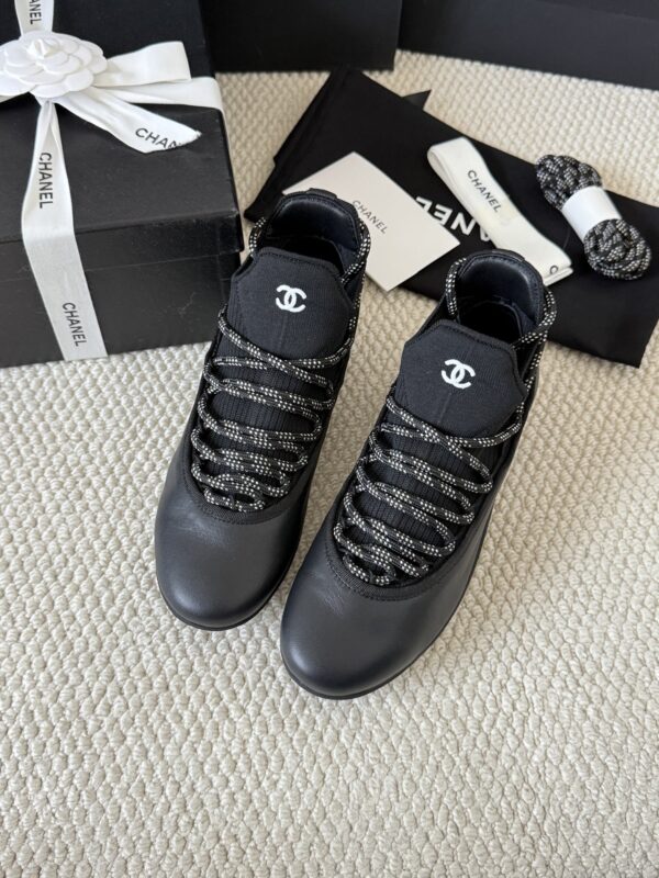 sy_no_301C920624F03E29F93F7AC768B3CE56_2 Chanel Black Leather and Knit Slip-On Low-Top Sneaker with Speckled Laces and CC Logo