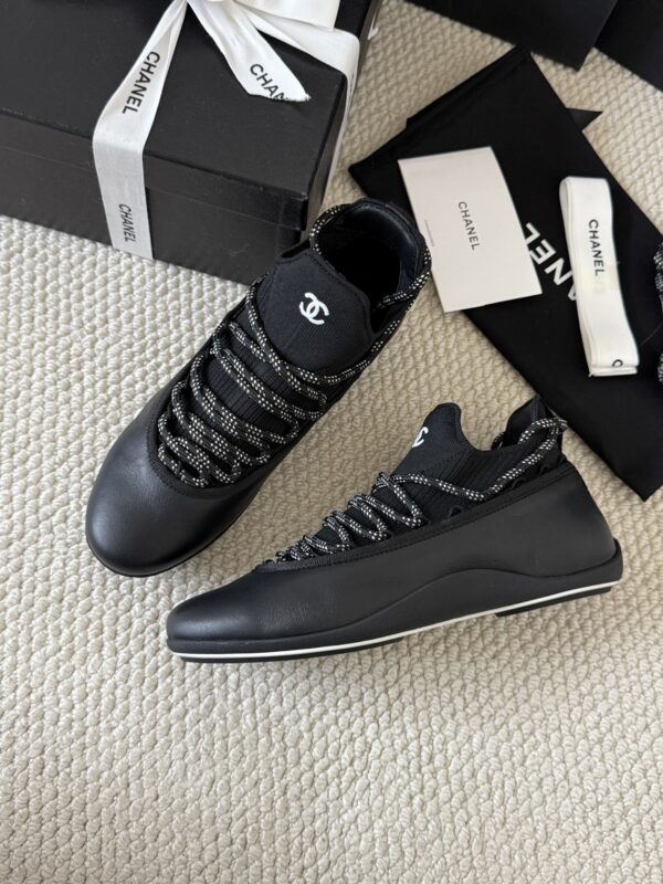 sy_no_301C920624F03E29F93F7AC768B3CE56_3 Chanel Black Leather and Knit Slip-On Low-Top Sneaker with Speckled Laces and CC Logo