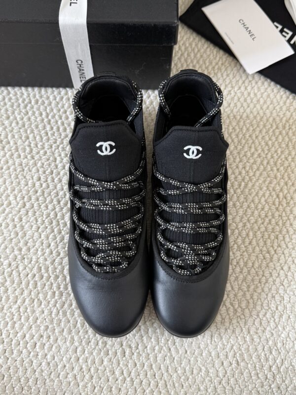 sy_no_301C920624F03E29F93F7AC768B3CE56_4 Chanel Black Leather and Knit Slip-On Low-Top Sneaker with Speckled Laces and CC Logo