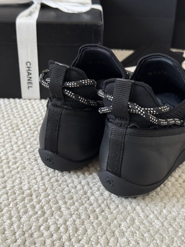 sy_no_301C920624F03E29F93F7AC768B3CE56_6 Chanel Black Leather and Knit Slip-On Low-Top Sneaker with Speckled Laces and CC Logo