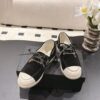 Chanel Black Suede Low-Top Shoe with Cap-Toe & CC Chain Detail