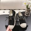 Chanel Black Suede Low-Top Shoe with Cap-Toe & CC Chain Detail