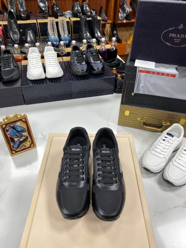 sy_no_3382BCB0367841513A8DDF1B1892AEDC_0 Prada All-Black Mesh Leather Triangle Logo Trainer