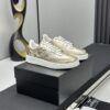 Chanel Metallic Gold Leather Low-Top Sneaker with Perforated Details & CC Logo