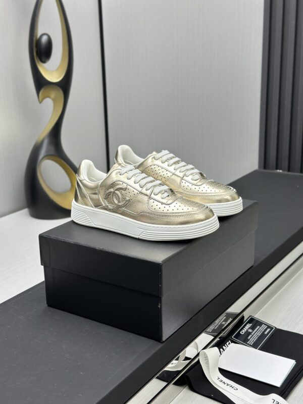 Chanel Metallic Gold Leather Low-Top Sneaker with Perforated Details & CC Logo