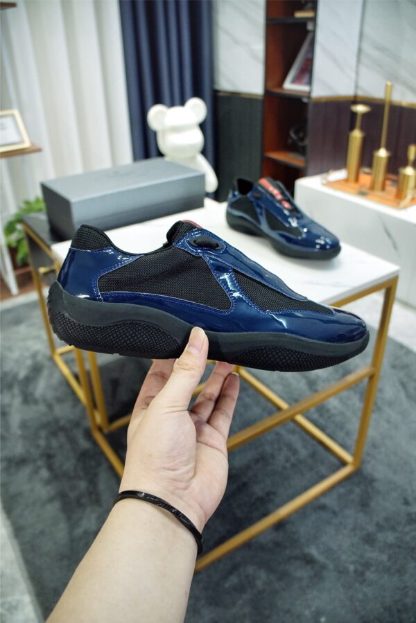 sy_no_371791160A31BC34A5E5F4AFE2E5B6A2_1 Prada America's Cup Navy Patent Mesh Sneaker