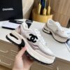 sy_no_3850401E4B8C7838C2652833F24D170A_0 Chanel Beige and White Chunky Sneaker with Black CC Logo and Metallic Trim