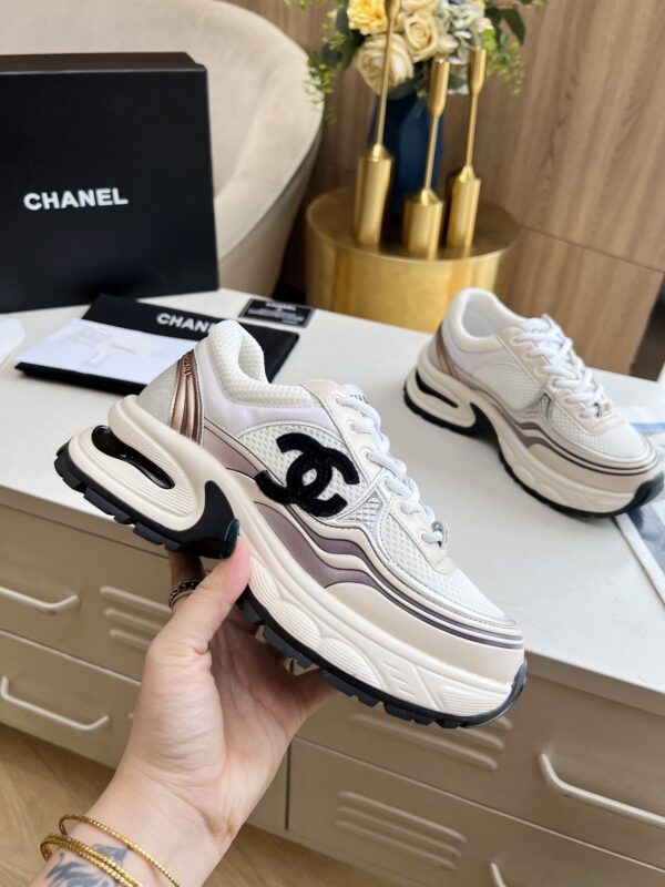sy_no_3850401E4B8C7838C2652833F24D170A_0 Chanel Beige and White Chunky Sneaker with Black CC Logo and Metallic Trim