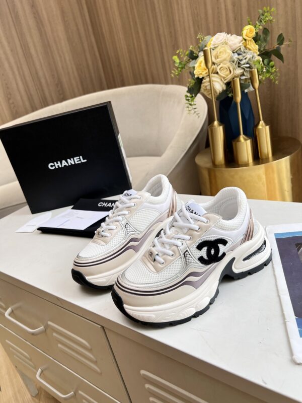 sy_no_3850401E4B8C7838C2652833F24D170A_1 Chanel Beige and White Chunky Sneaker with Black CC Logo and Metallic Trim