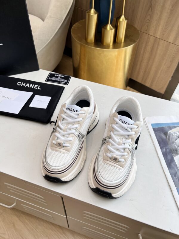 sy_no_3850401E4B8C7838C2652833F24D170A_2 Chanel Beige and White Chunky Sneaker with Black CC Logo and Metallic Trim