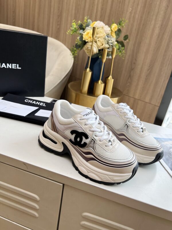 sy_no_3850401E4B8C7838C2652833F24D170A_3 Chanel Beige and White Chunky Sneaker with Black CC Logo and Metallic Trim