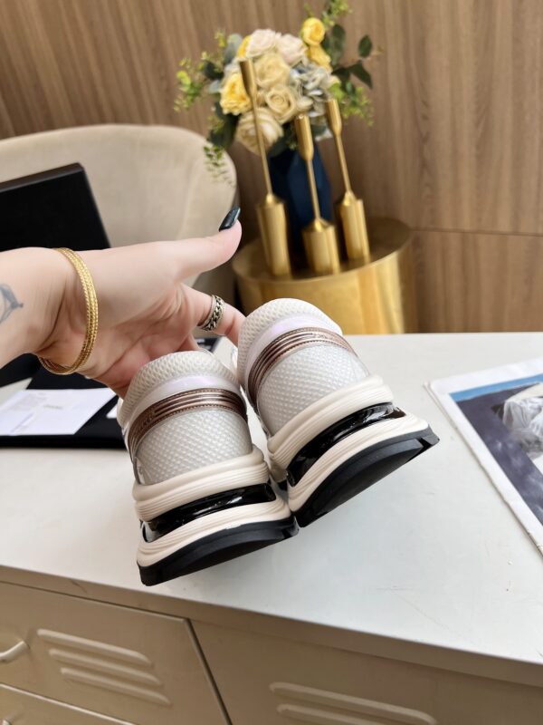 sy_no_3850401E4B8C7838C2652833F24D170A_4 Chanel Beige and White Chunky Sneaker with Black CC Logo and Metallic Trim