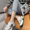 sy_no_3850401E4B8C7838C2652833F24D170A_6 Chanel Beige and White Chunky Sneaker with Black CC Logo and Metallic Trim