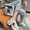 sy_no_3850401E4B8C7838C2652833F24D170A_7 Chanel Beige and White Chunky Sneaker with Black CC Logo and Metallic Trim