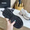 sy_no_3850401E4B8C7838C2652833F24D170A_8 Chanel Beige and White Chunky Sneaker with Black CC Logo and Metallic Trim