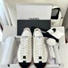 Chanel White and Black Cap-Toe Low-Top Sneaker with Suede Detailing