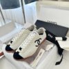Chanel White and Black Cap-Toe Low-Top Sneaker with Suede Detailing