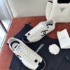 Chanel White and Black Cap-Toe Low-Top Sneaker with Suede Detailing