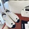 Chanel White and Black Cap-Toe Low-Top Sneaker with Suede Detailing