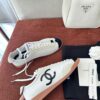 Chanel White and Black Cap-Toe Low-Top Sneaker with Suede Detailing