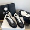 Chanel Black Quilted Leather Low-Top Sneaker with White Laces and CC Logo