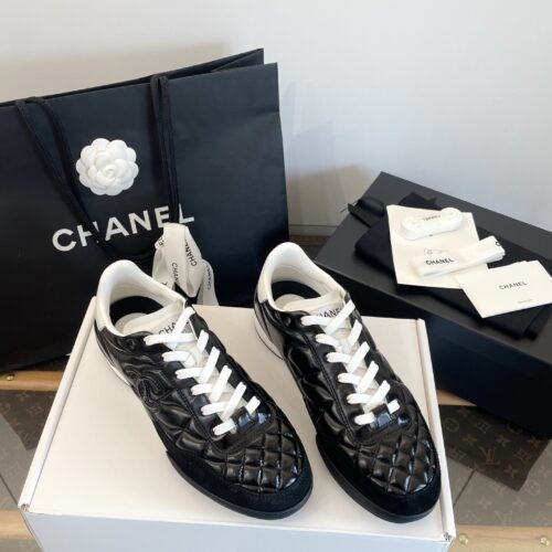 Chanel Black Quilted Leather Low-Top Sneaker with White Laces and CC Logo