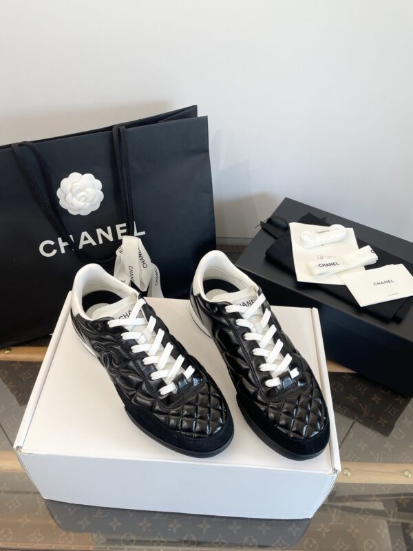 Chanel Black Quilted Leather Low-Top Sneaker with White Laces and CC Logo
