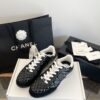 Chanel Black Quilted Leather Low-Top Sneaker with White Laces and CC Logo