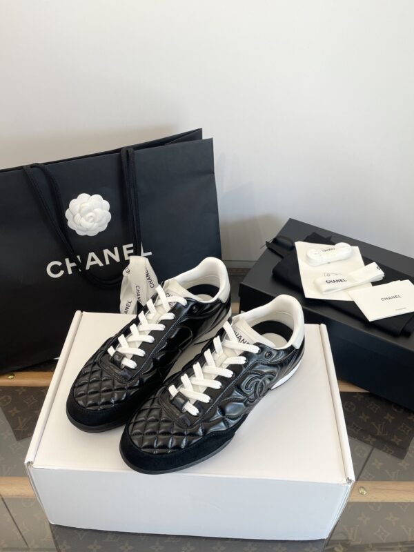 Chanel Black Quilted Leather Low-Top Sneaker with White Laces and CC Logo
