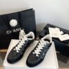 Chanel Black Quilted Leather Low-Top Sneaker with White Laces and CC Logo