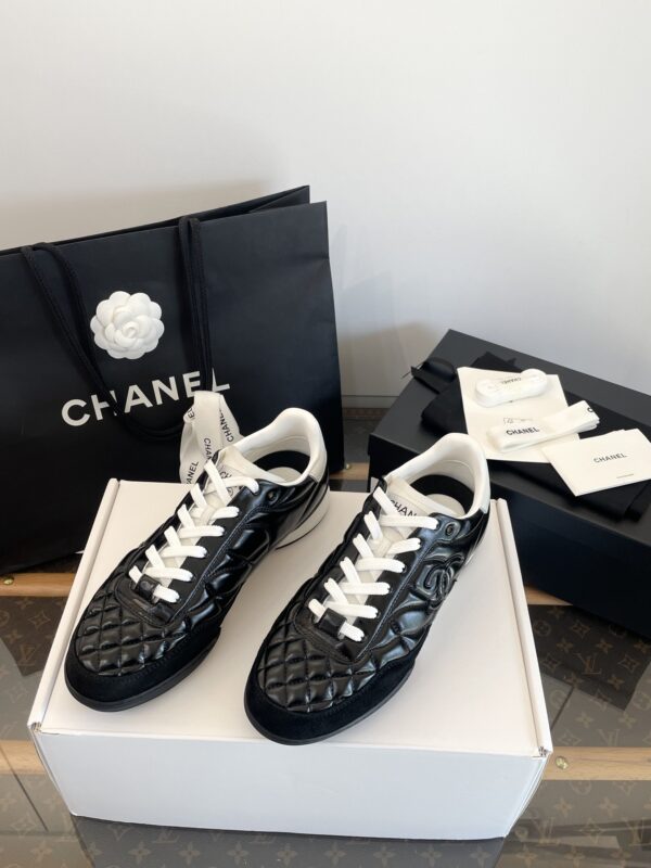 Chanel Black Quilted Leather Low-Top Sneaker with White Laces and CC Logo