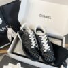 Chanel Black Quilted Leather Low-Top Sneaker with White Laces and CC Logo