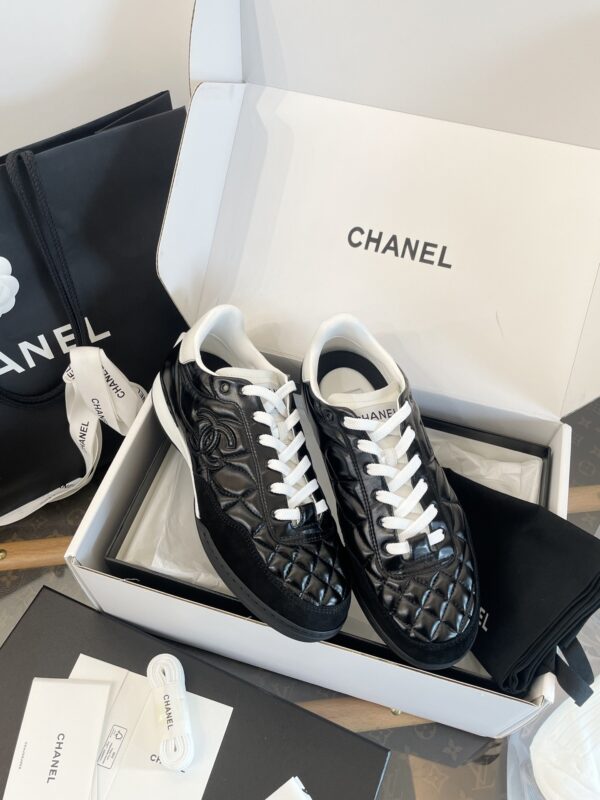Chanel Black Quilted Leather Low-Top Sneaker with White Laces and CC Logo