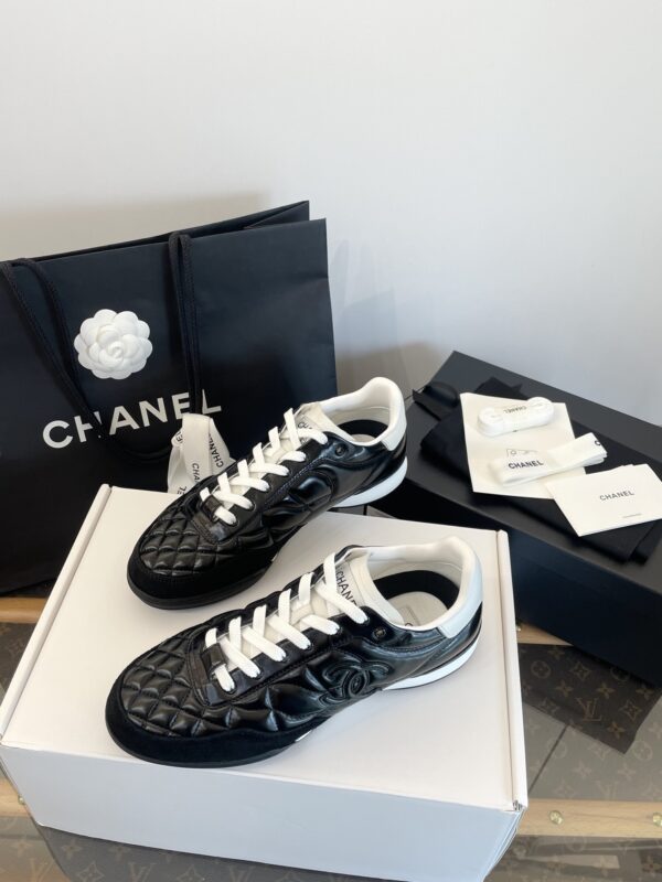 Chanel Black Quilted Leather Low-Top Sneaker with White Laces and CC Logo
