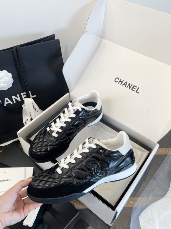 Chanel Black Quilted Leather Low-Top Sneaker with White Laces and CC Logo