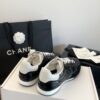 Chanel Black Quilted Leather Low-Top Sneaker with White Laces and CC Logo