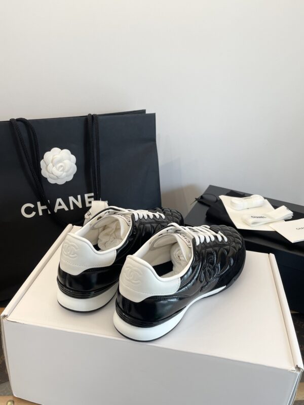 Chanel Black Quilted Leather Low-Top Sneaker with White Laces and CC Logo