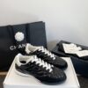 Chanel Black Quilted Leather Low-Top Sneaker with White Laces and CC Logo
