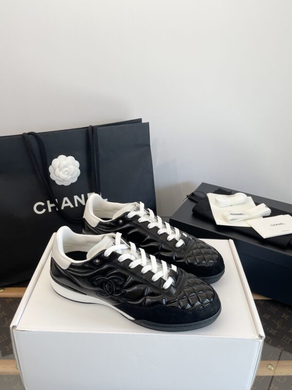 Chanel Black Quilted Leather Low-Top Sneaker with White Laces and CC Logo