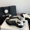 Chanel Black Quilted Leather Low-Top Sneaker with White Laces and CC Logo