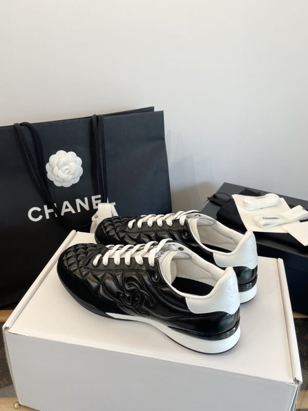 Chanel Black Quilted Leather Low-Top Sneaker with White Laces and CC Logo