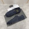 sy_no_46BA6ED7FEFA6AE4EA34F459B0EEEC3C_1 Prada Navy Suede Gold Logo Trainer
