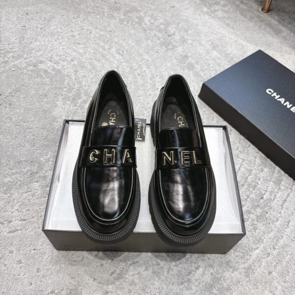 sy_no_4BCFEB4E3C031C369D9B33E00837FEA9_0 Chanel Black Platform Loafer with Gold-Tone Metal Lettering
