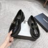 sy_no_4BCFEB4E3C031C369D9B33E00837FEA9_1 Chanel Black Platform Loafer with Gold-Tone Metal Lettering