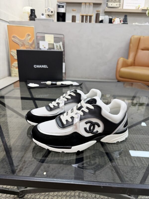 sy_no_4EC2EE923632FAB90C4C005F8F34B381_0 Chanel Black & White Chunky Sneaker with Silver Accents & Interlocking CC Logo